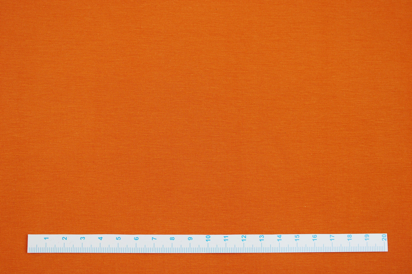 Baumwolljersey Vanessa in uni orange Maßstab