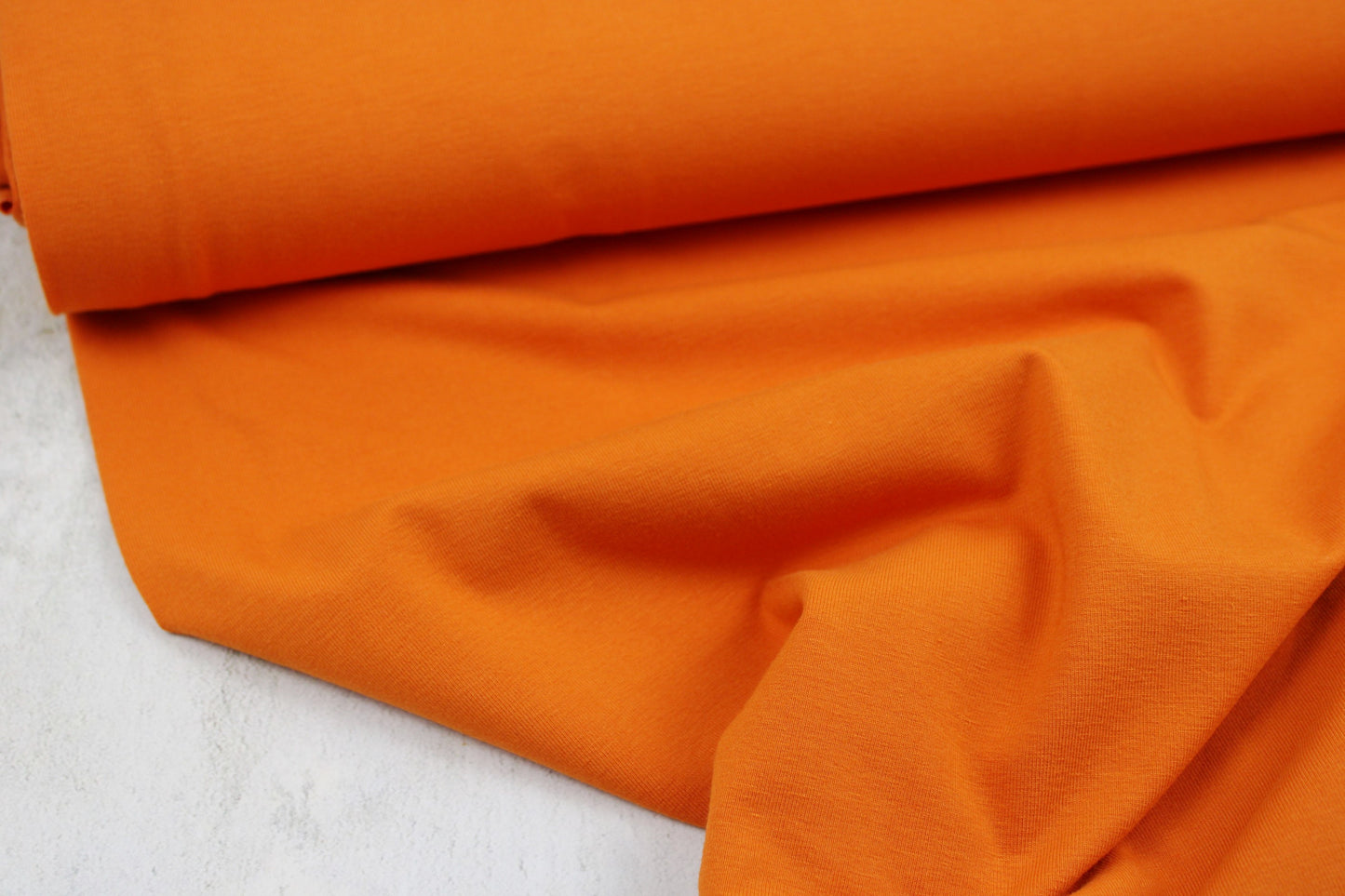 Baumwolljersey Vanessa in uni orange Ballenansicht