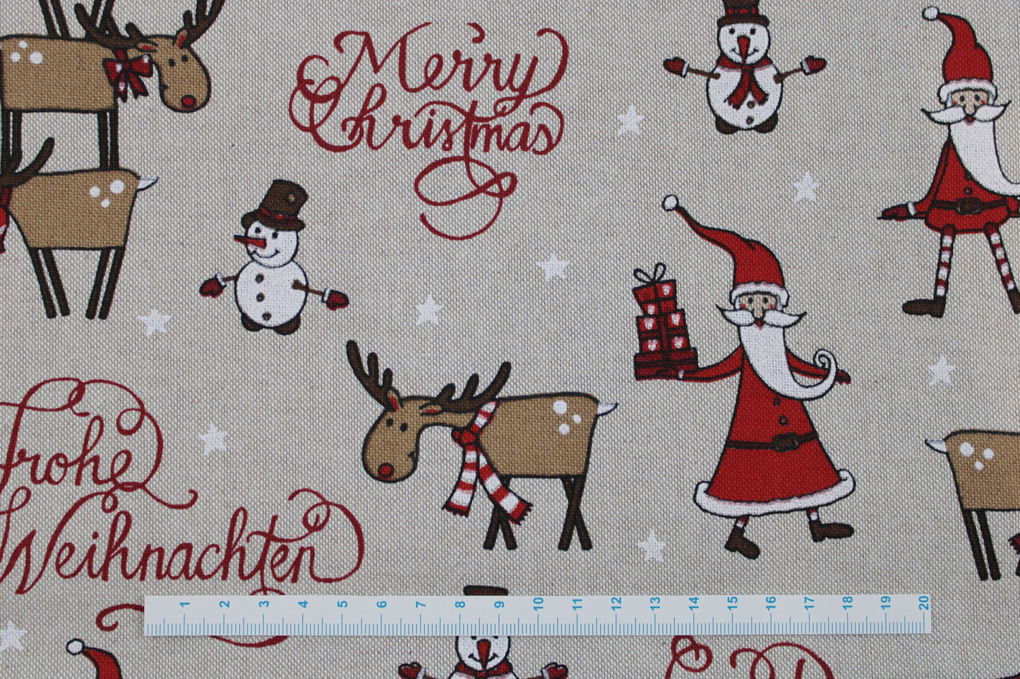 Canvasstoff Emil mit fröhlichen Weihnachtsmotiven auf beigem Grund Detailbild