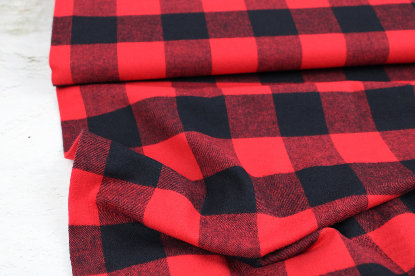 Flanellstoff Maverick mit aros in Rot und schwarz Ballenansicht