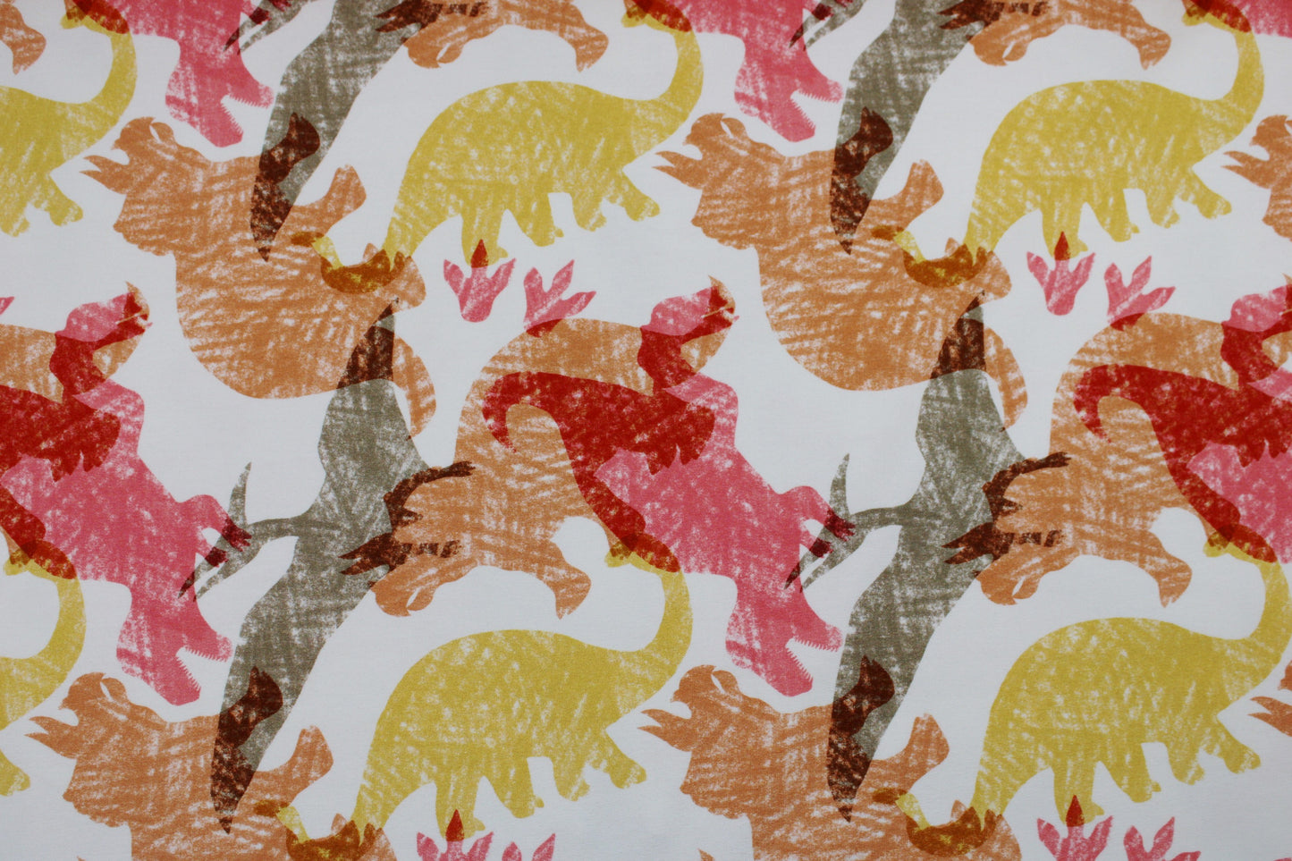 Heller French Terry Sweat mit Dinosauriern in Rot, Gelb und Orange Detailbild