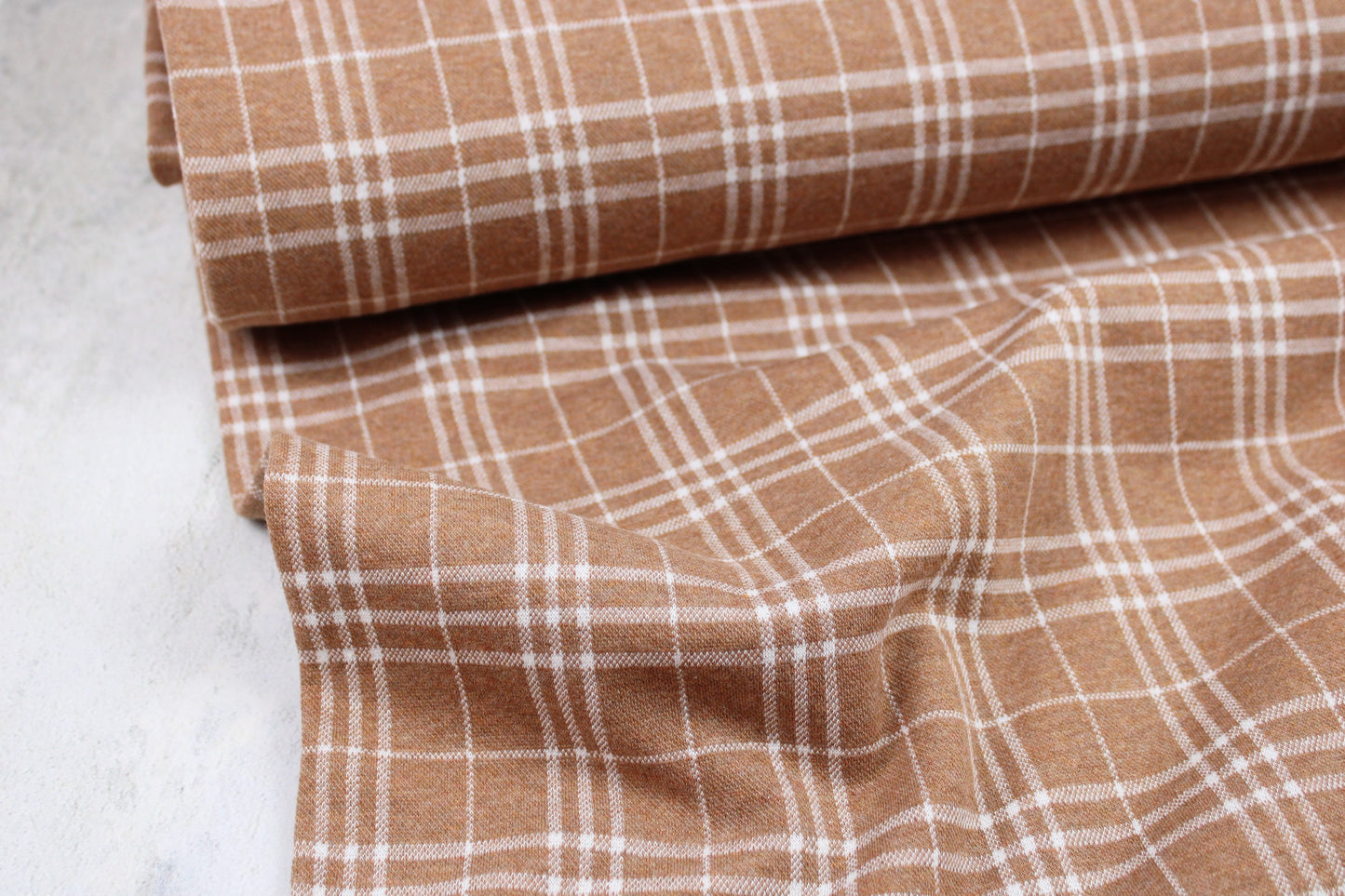 Jacquardjersey mit Glecheck-Karo-Muster in rostbraun/ecru Ballenansicht