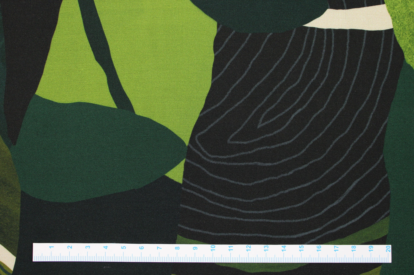 Abstrakter Viskosestoff in grün Tönen Maßstab