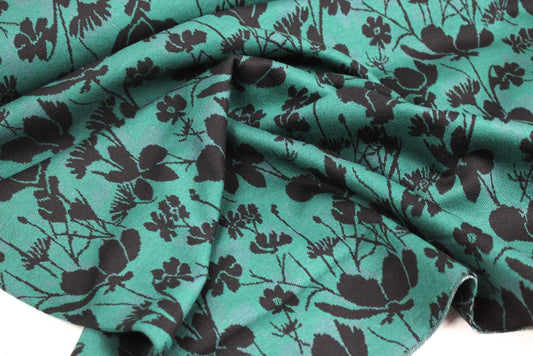 Grüner Jacquardjersey Wildflowers mit schwarzen Blumen
