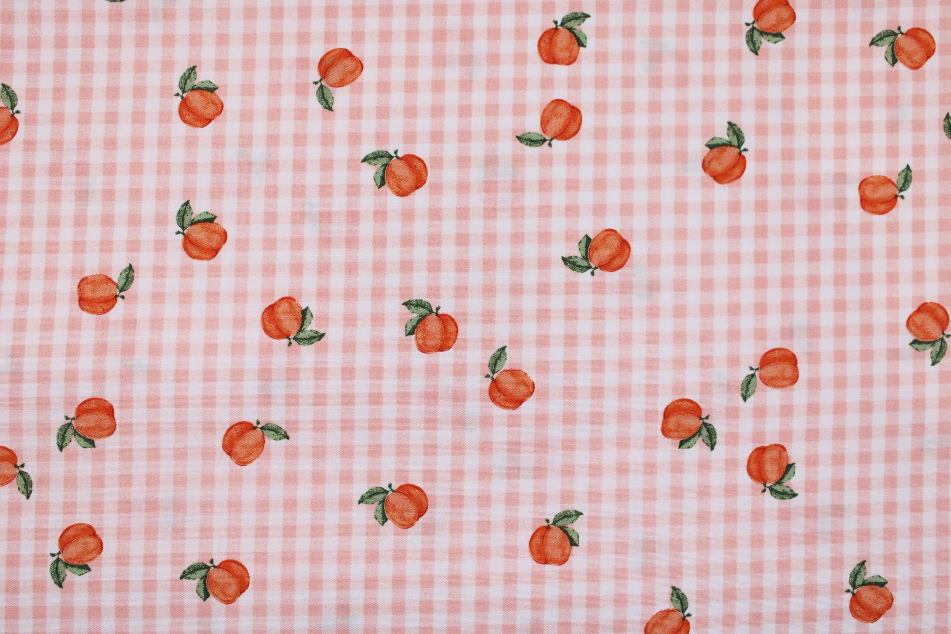 Baumwollstoff Fruta kleine Früchte auf orange-weiß kariertem Grund Detailbild