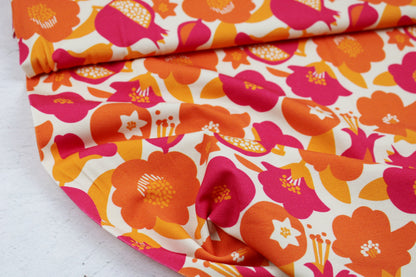 Baumwolljersey mit Retroblumen in Orange- und Pinktönen Ballenansicht