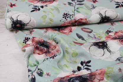 Waffelersey Lisa mit Blumenmuster auf mint farbenem Grund Ballenansicht