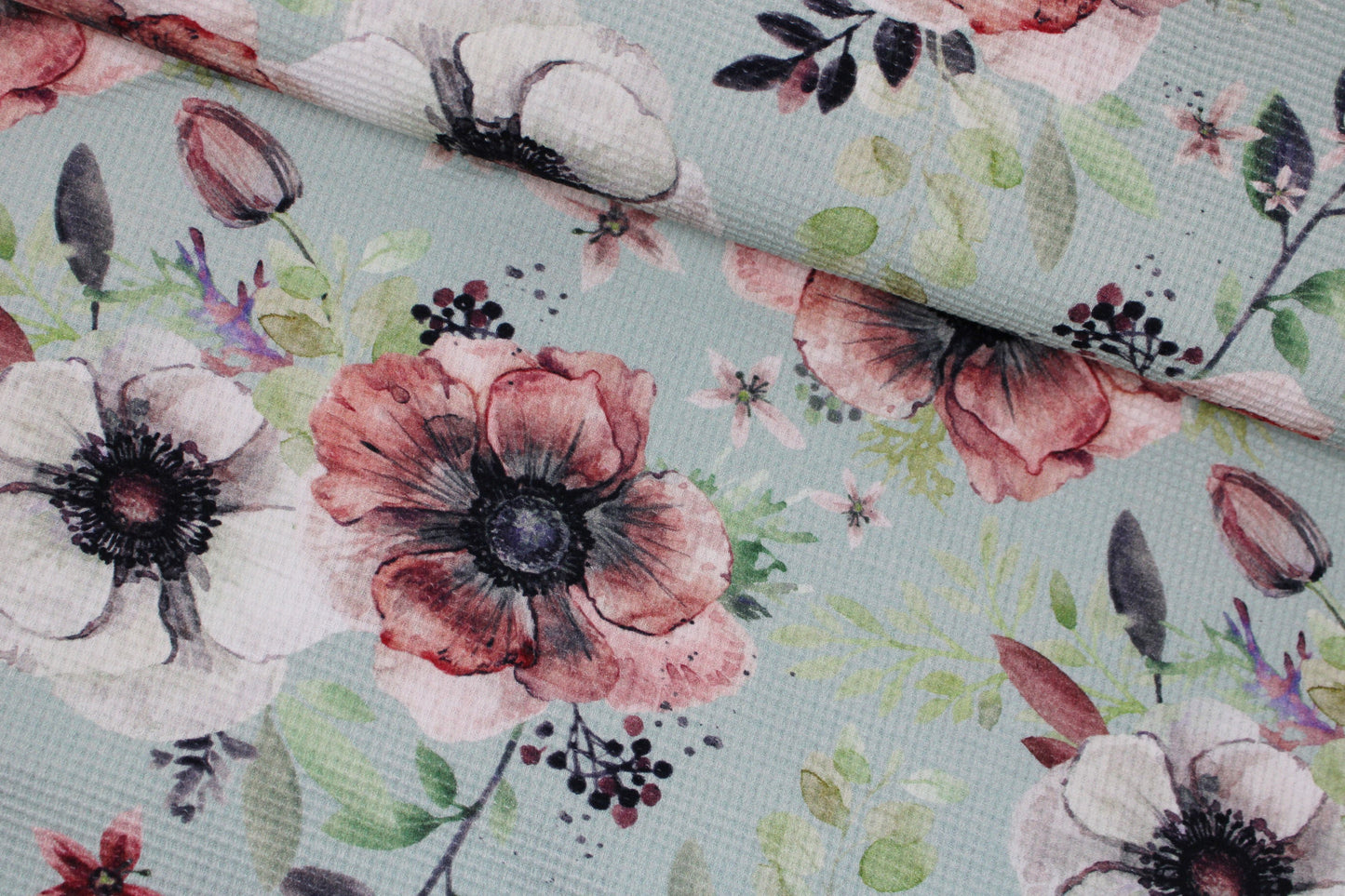 Waffelersey Lisa mit Blumenmuster auf mint farbenem Grund quer