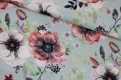 Waffelersey Lisa mit Blumenmuster auf mint farbenem Grund quer