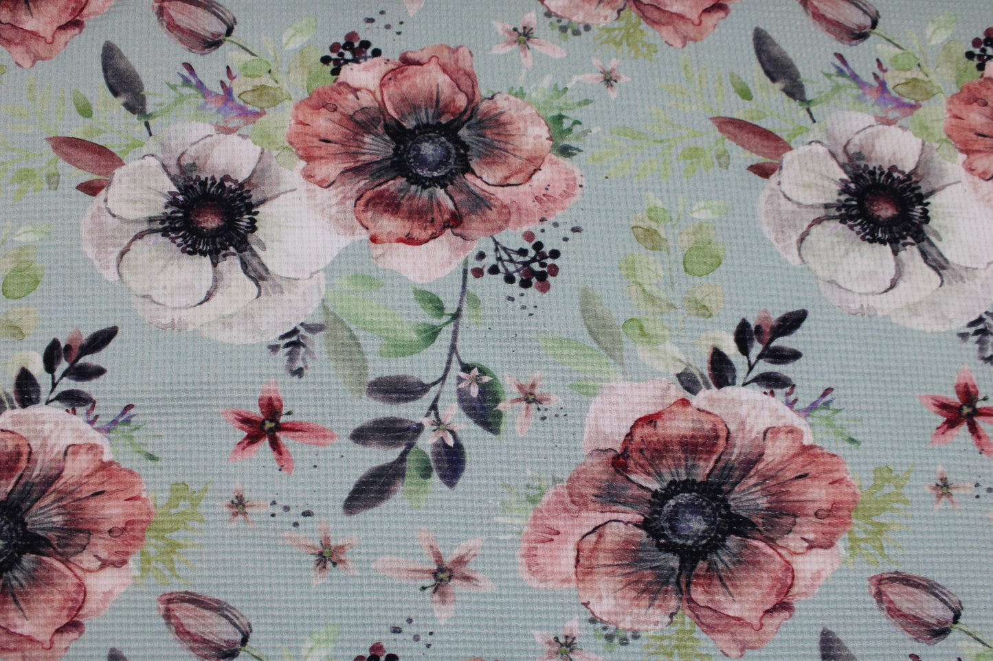 Waffelersey Lisa mit Blumenmuster auf mint farbenem Grund Detailbild