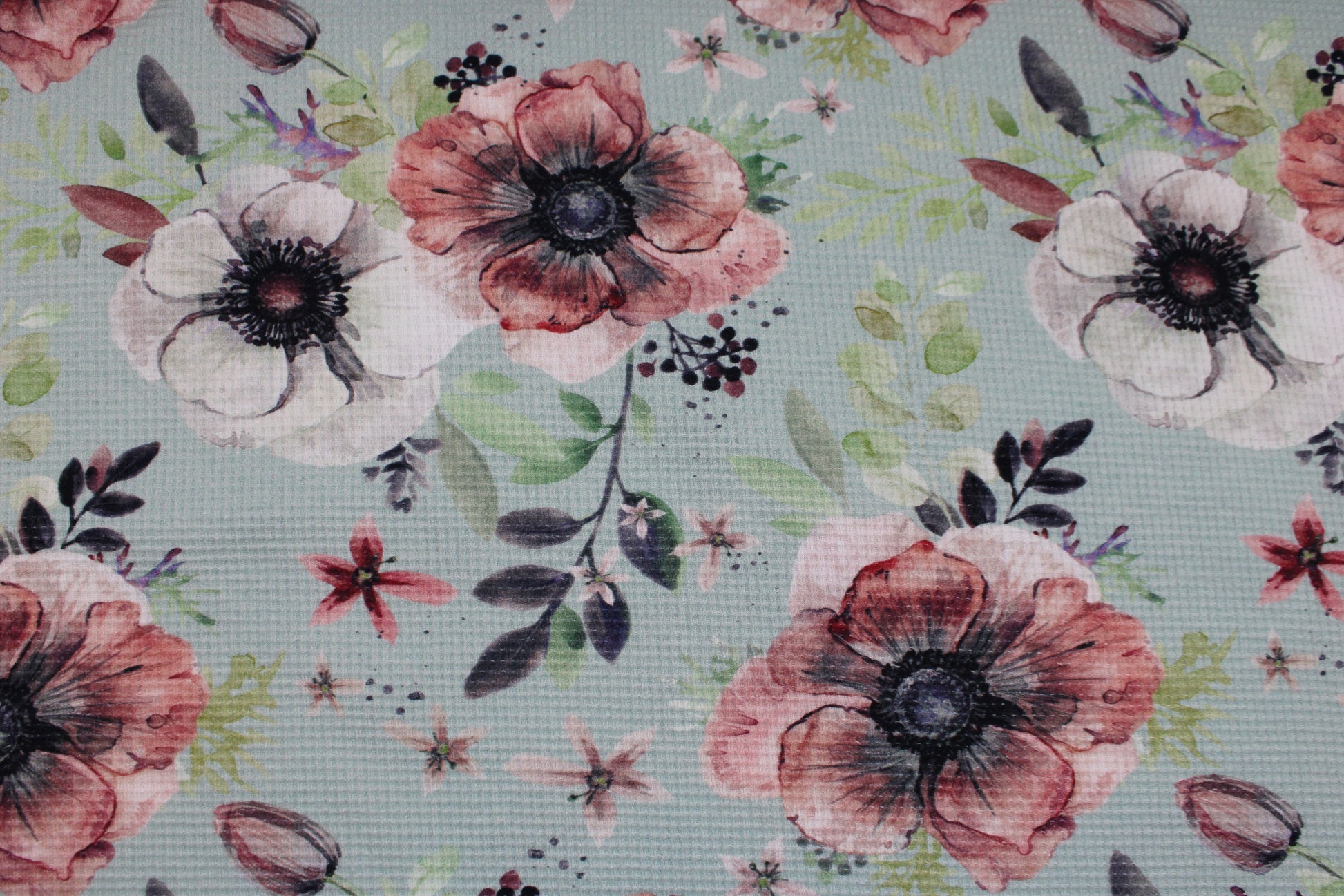 Waffelersey Lisa mit Blumenmuster auf mint farbenem Grund Detailbild
