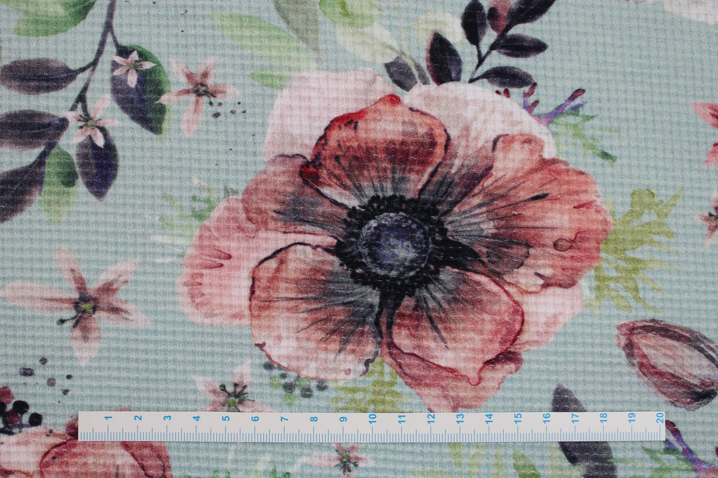 Waffelersey Lisa mit Blumenmuster auf mint farbenem Grund Maßstab