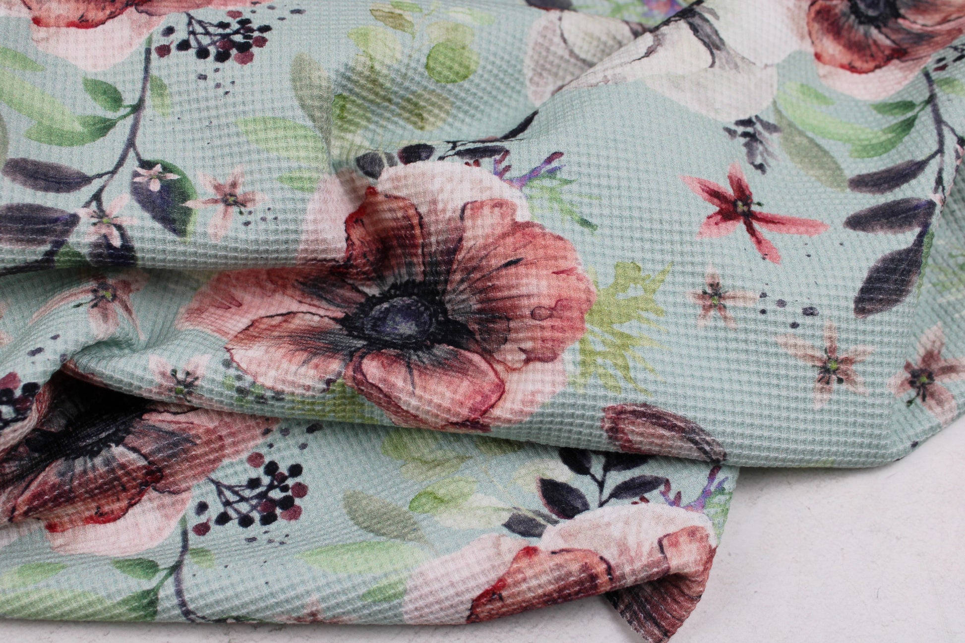 Waffelersey Lisa mit Blumenmuster auf mint farbenem Grund