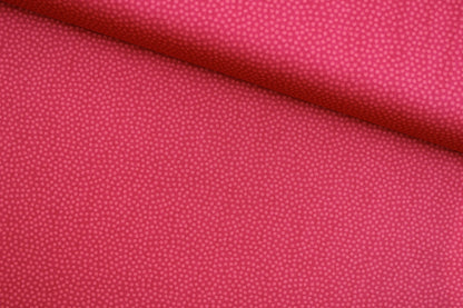 Baumwollstoff Dotty mit kleinen roten Pünktchen Ton in Ton quer