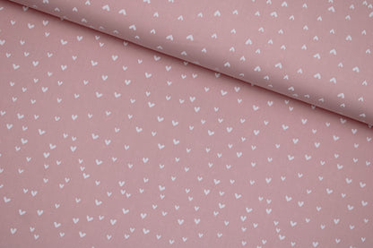 Rosa farbener Baumwollstoff Mini Heart mit kleinen weißen Herzen quer