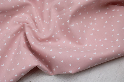 Rosa farbener Baumwollstoff Mini Heart mit kleinen weißen Herzen