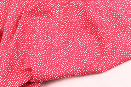 Baumwollstoff Garden Pindot in Koralle mit kleinen weißen Pünktchen