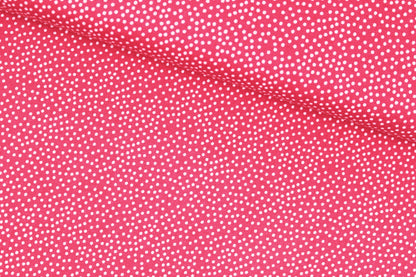 Baumwollstoff Garden Pindot in Koralle mit kleinen weißen Pünktchen quer