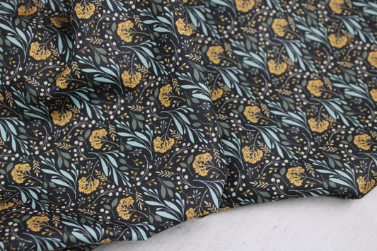 Dunkelgrauer Baumwollstoff Garden of Dreams mit Blumen in Mint und Ocker