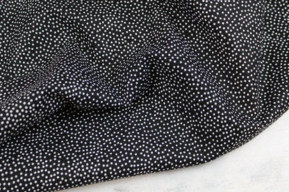 Schwarzer Baumwollstoff Garden Pindot mit kleinen weißen Pünktchen