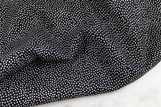 Schwarzer Baumwollstoff Garden Pindot mit kleinen weißen Pünktchen