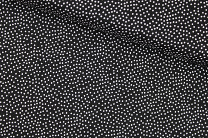 Schwarzer Baumwollstoff Garden Pindot mit kleinen weißen Pünktchen quer