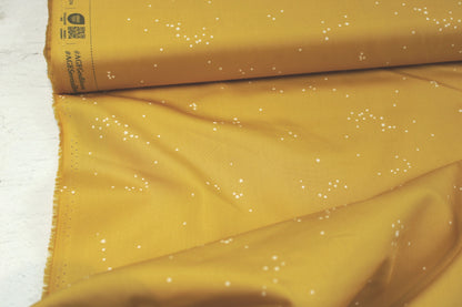 Baumwollstoff Glowdust Golden mit kleinen Sternen aus der Geobloom-Kollektion von Art Gallery Fabrics Detailbild Ballenansicht