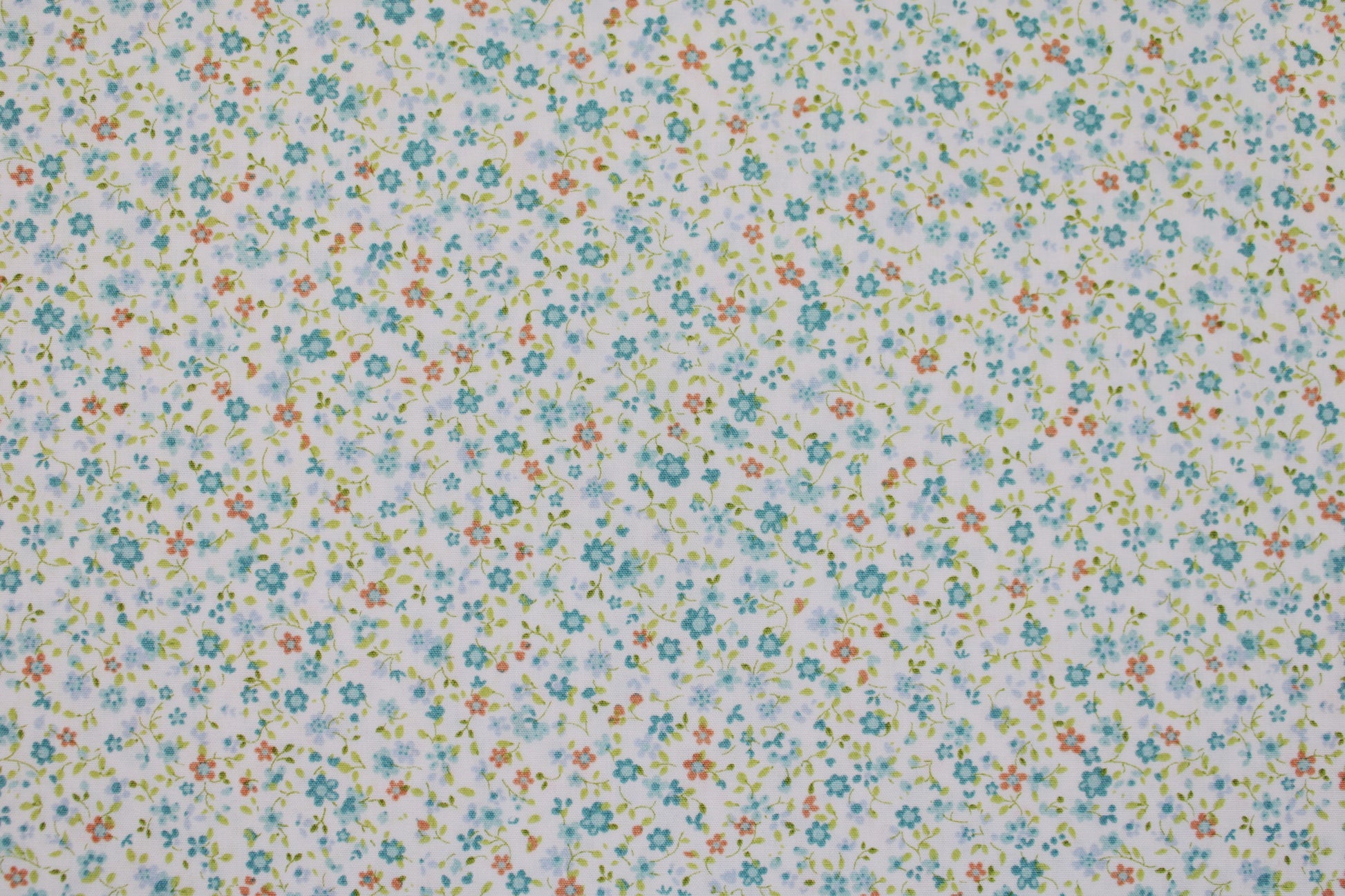 Baumwollstoff Minis mit kleinen Blümchen in Hellblau auf weißem Grund Detailbild