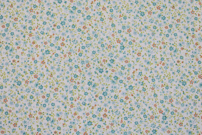 Baumwollstoff Minis mit kleinen Blümchen in Hellblau auf weißem Grund Detailbild