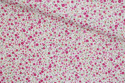 Baumwollstoff Minis mit kleinen Blümchen in Pink auf weißem Grund quer