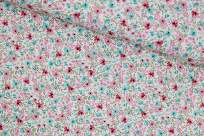 Baumwollstoff Natura mit kleinen Blümchen in Rosa und Türkis quer