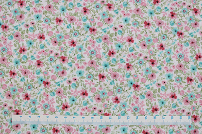 Baumwollstoff Natura mit kleinen Blümchen in Rosa und Türkis Maßstab