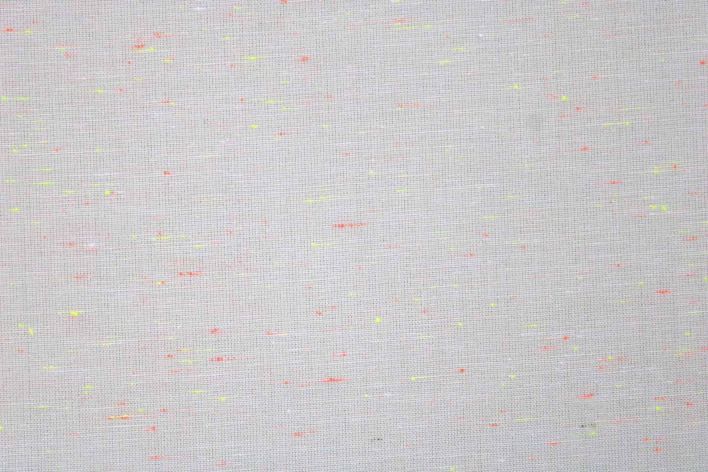 Baumwollstoff Neon Neppy mit kleinen Neonfäden in Gelb und Orange Detailbild
