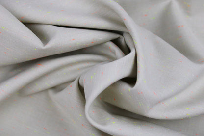 Baumwollstoff Neon Neppy mit kleinen Neonfäden in Gelb und Orange gedreht