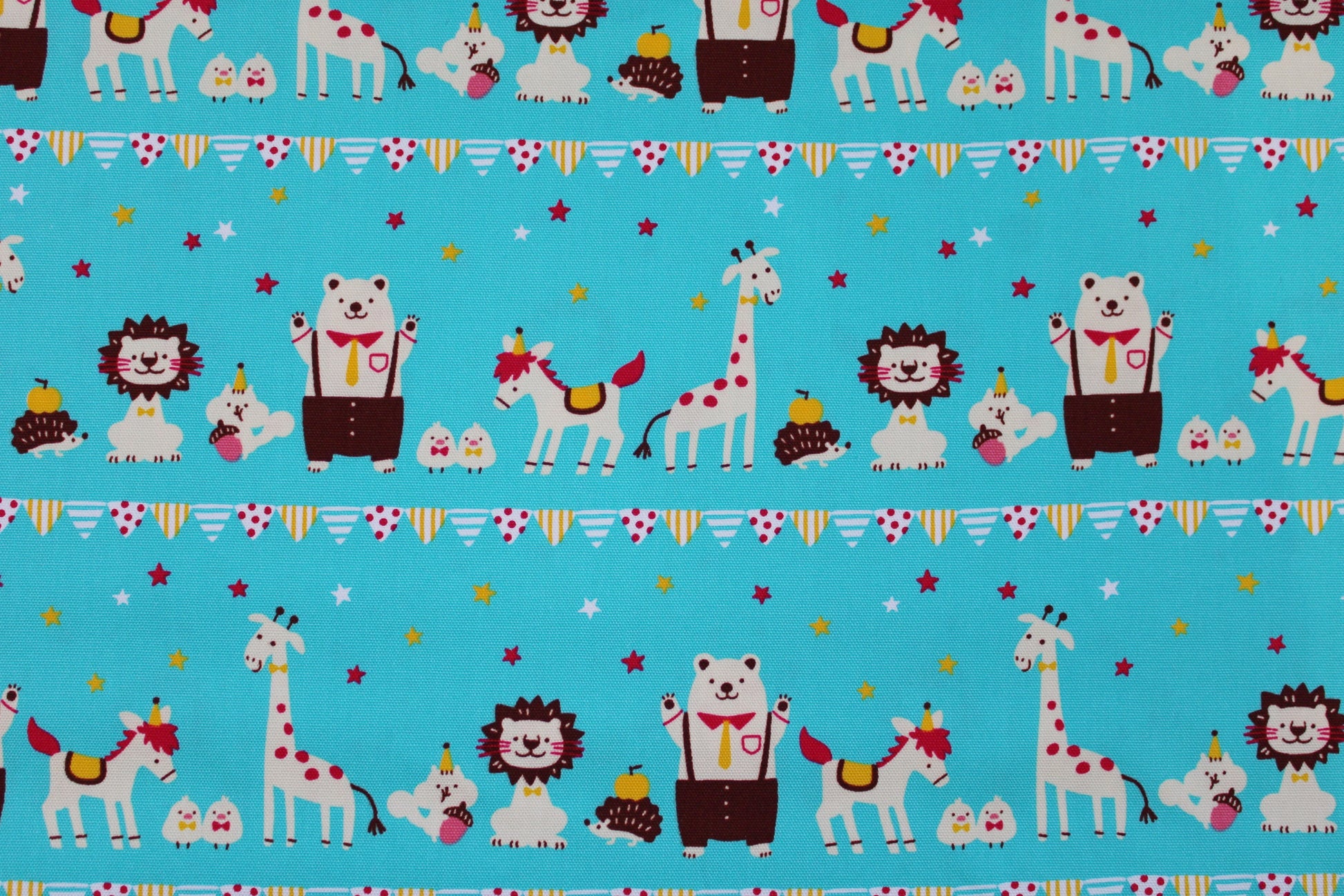 Türkis farbener Baumwollstoff mit Tiermotiven quer Detailbild