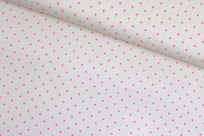 Wollweißer Baumwollstoff True Colors Tiny Dots mit Pink farbenen Punkten  quer