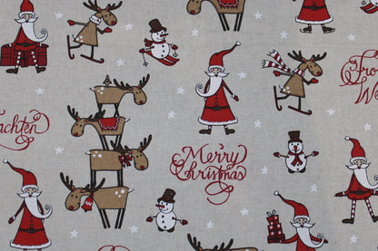 Canvasstoff Emil mit fröhlichen Weihnachtsmotiven auf beigem Grund Detailbild