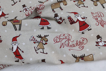 Canvasstoff Emil mit fröhlichen Weihnachtsmotiven auf beigem Grund