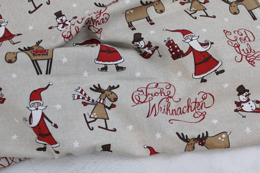 Canvasstoff Emil mit fröhlichen Weihnachtsmotiven auf beigem Grund