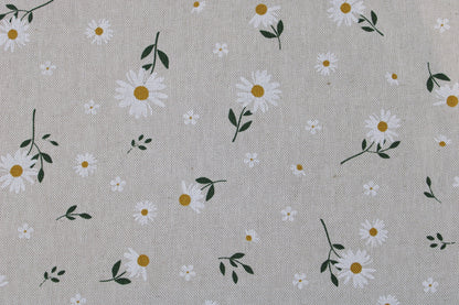 Canvasstoff mit kleinen Gänseblümchen auf beigem Grund Detailbild