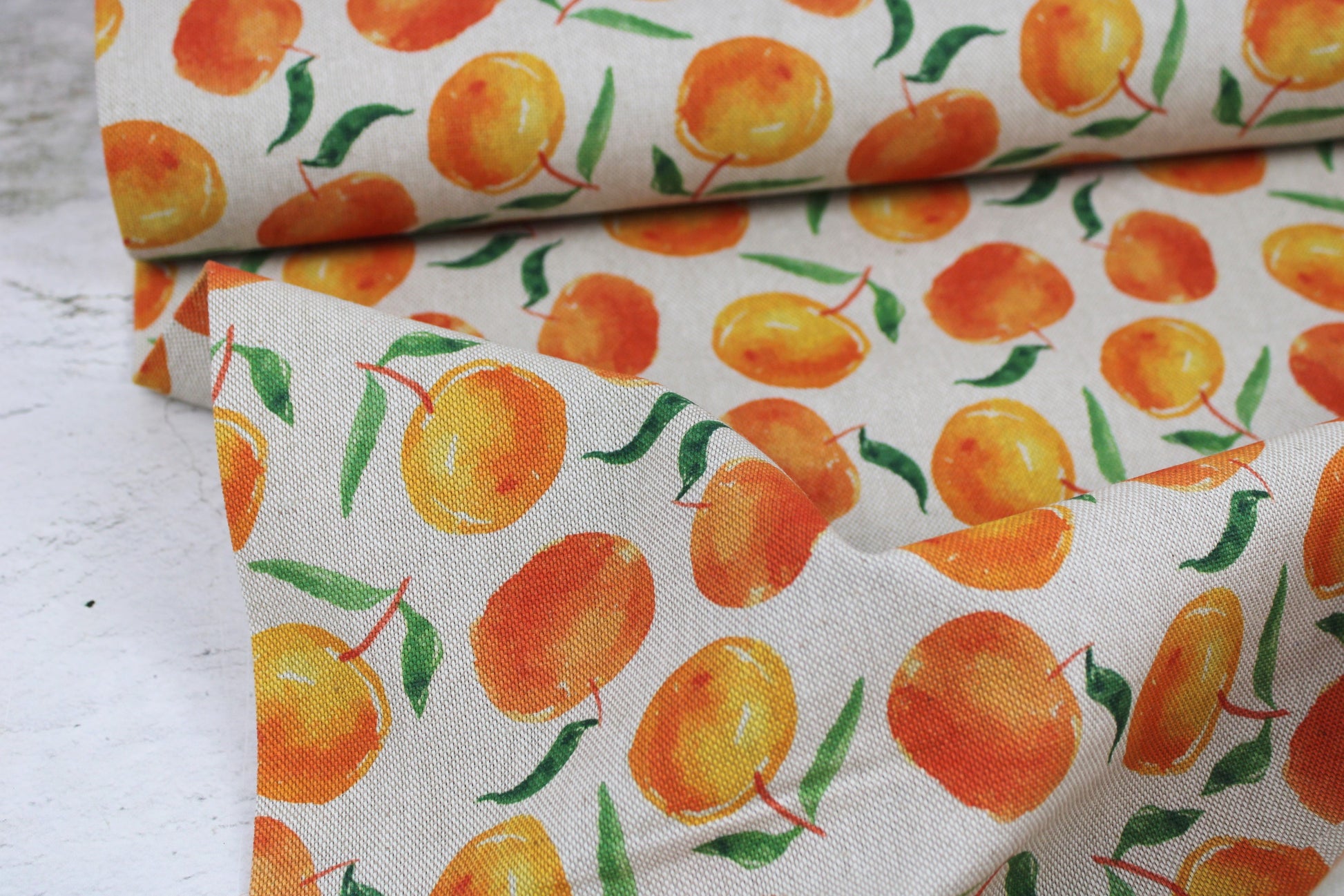 Canvasstoff Ulli mit Orangen auf beigem Grund Ballenansicht