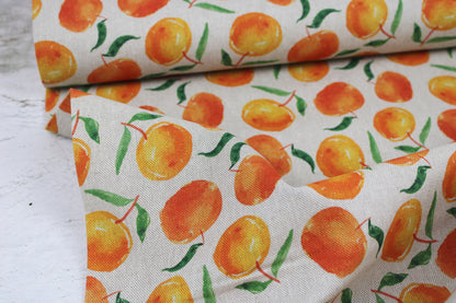 Canvasstoff Ulli mit Orangen auf beigem Grund Ballenansicht