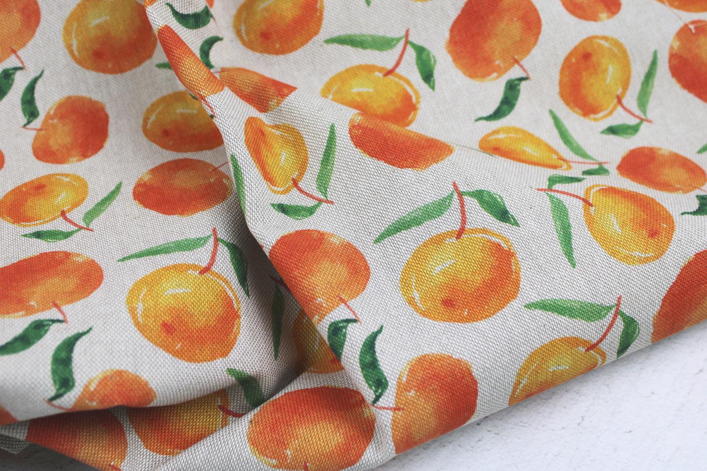 Canvasstoff Ulli mit Orangen auf beigem Grund