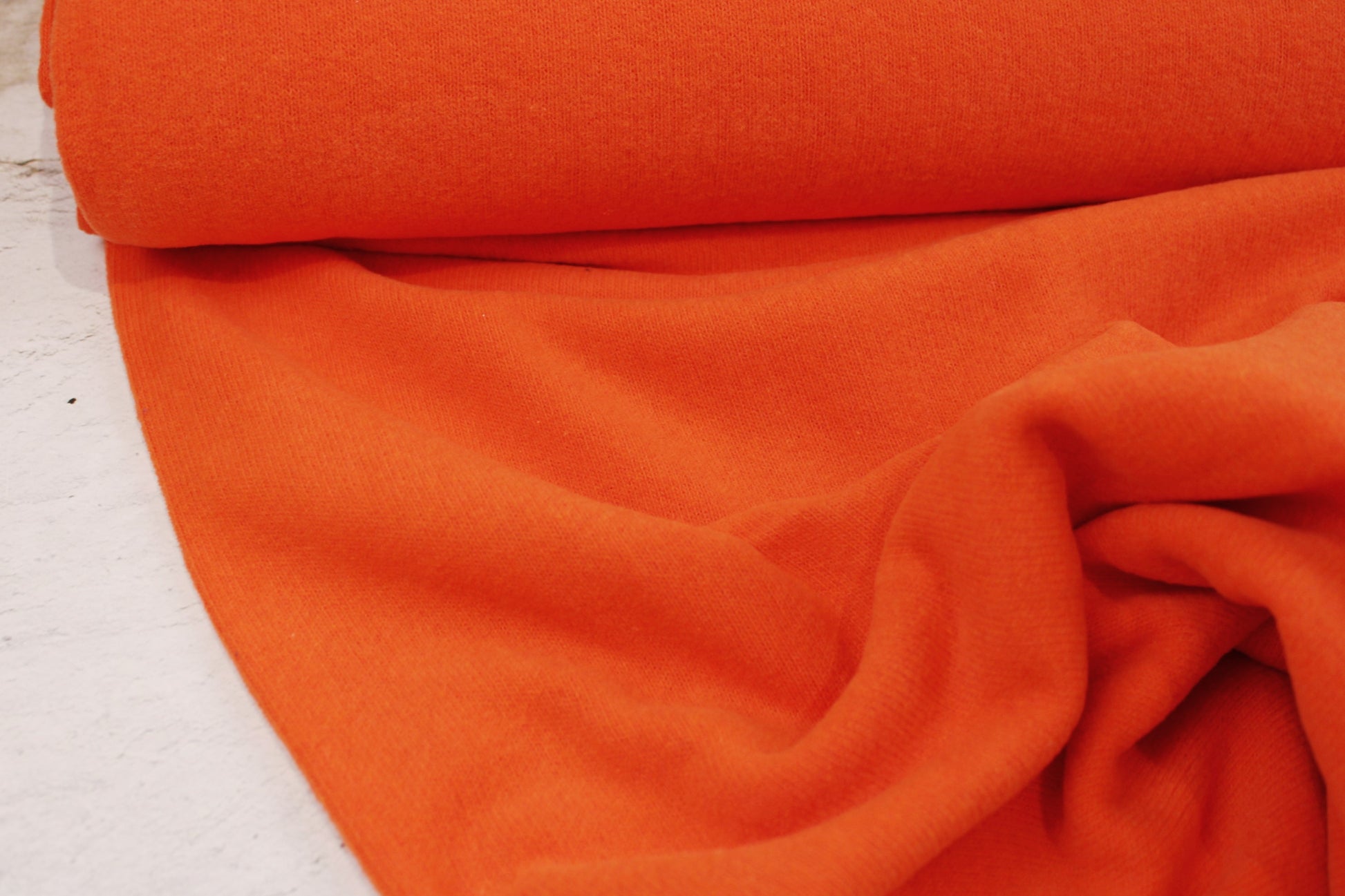 Feinstrick Gillo in uni orange Ballenansicht