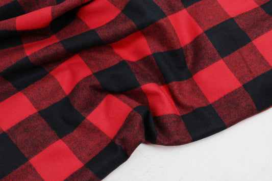 Flanellstoff Maverick mit aros in Rot und schwarz