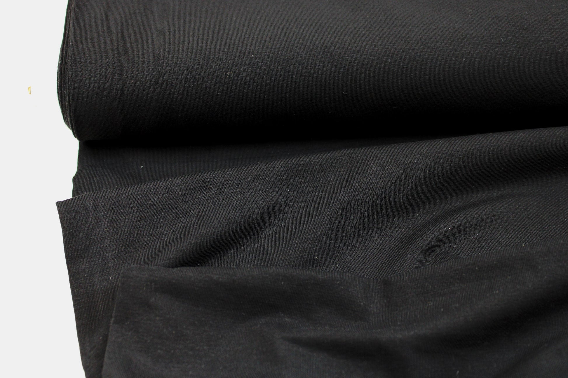 French Terry Sweatstoff Maike in uni Schwarz Ballenansicht
