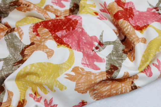 Heller French Terry Sweat mit Dinosauriern in Rot, Gelb und Orange