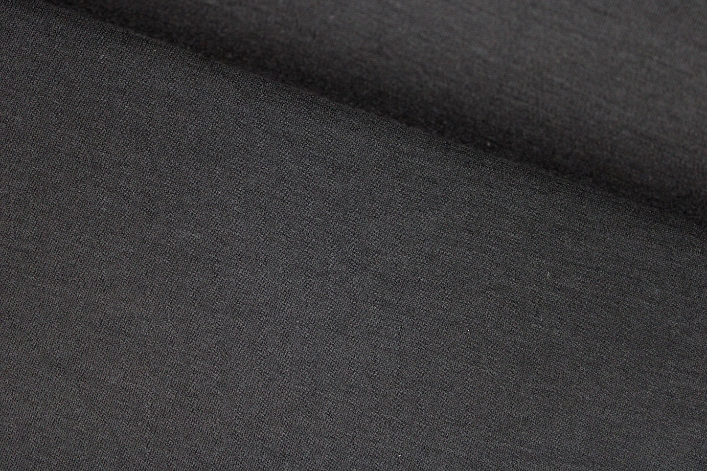 Merinostrickstoff Wolljersey in uni Schwarz quer
