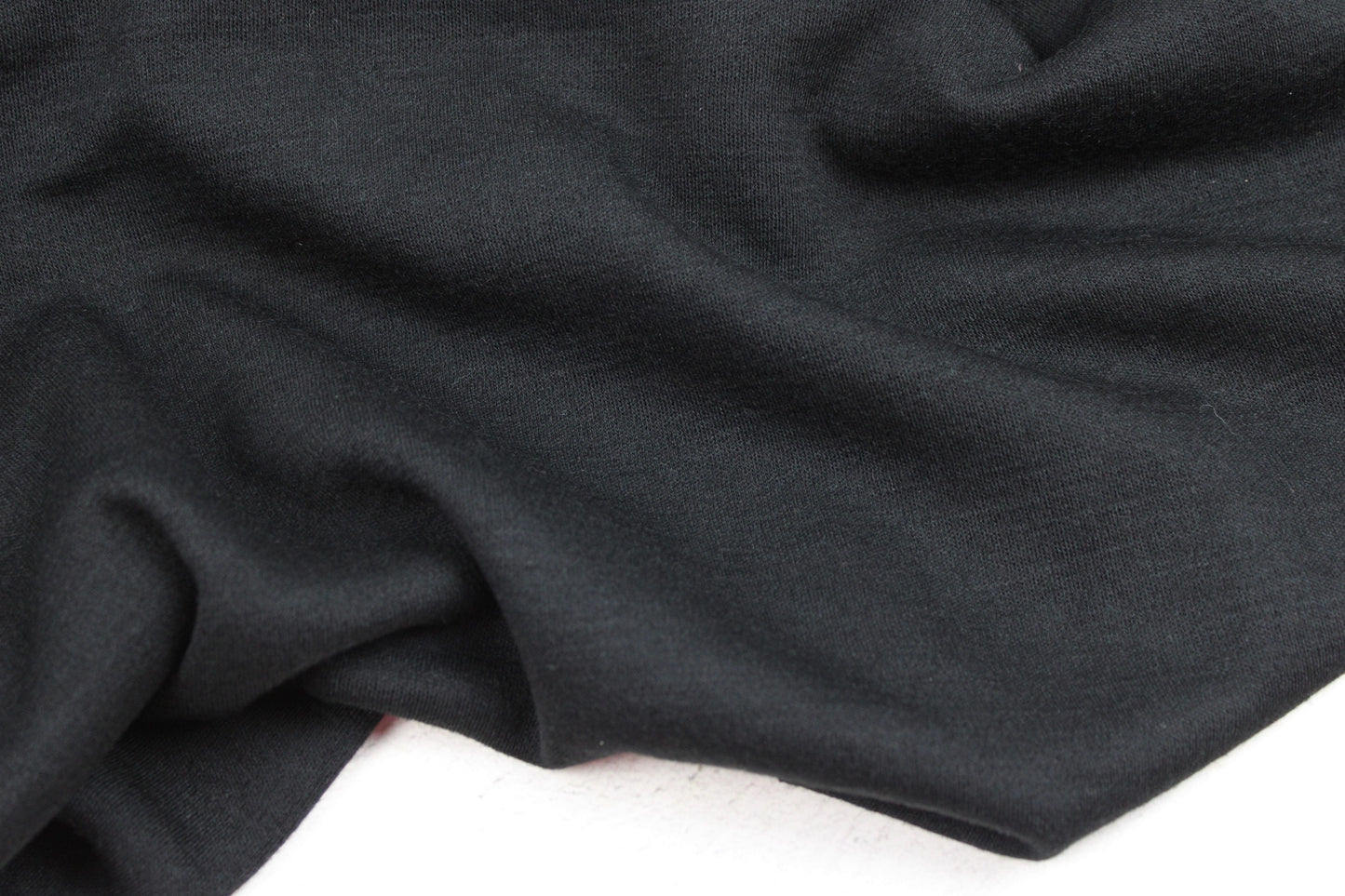 Merinostrickstoff Wolljersey in uni Schwarz