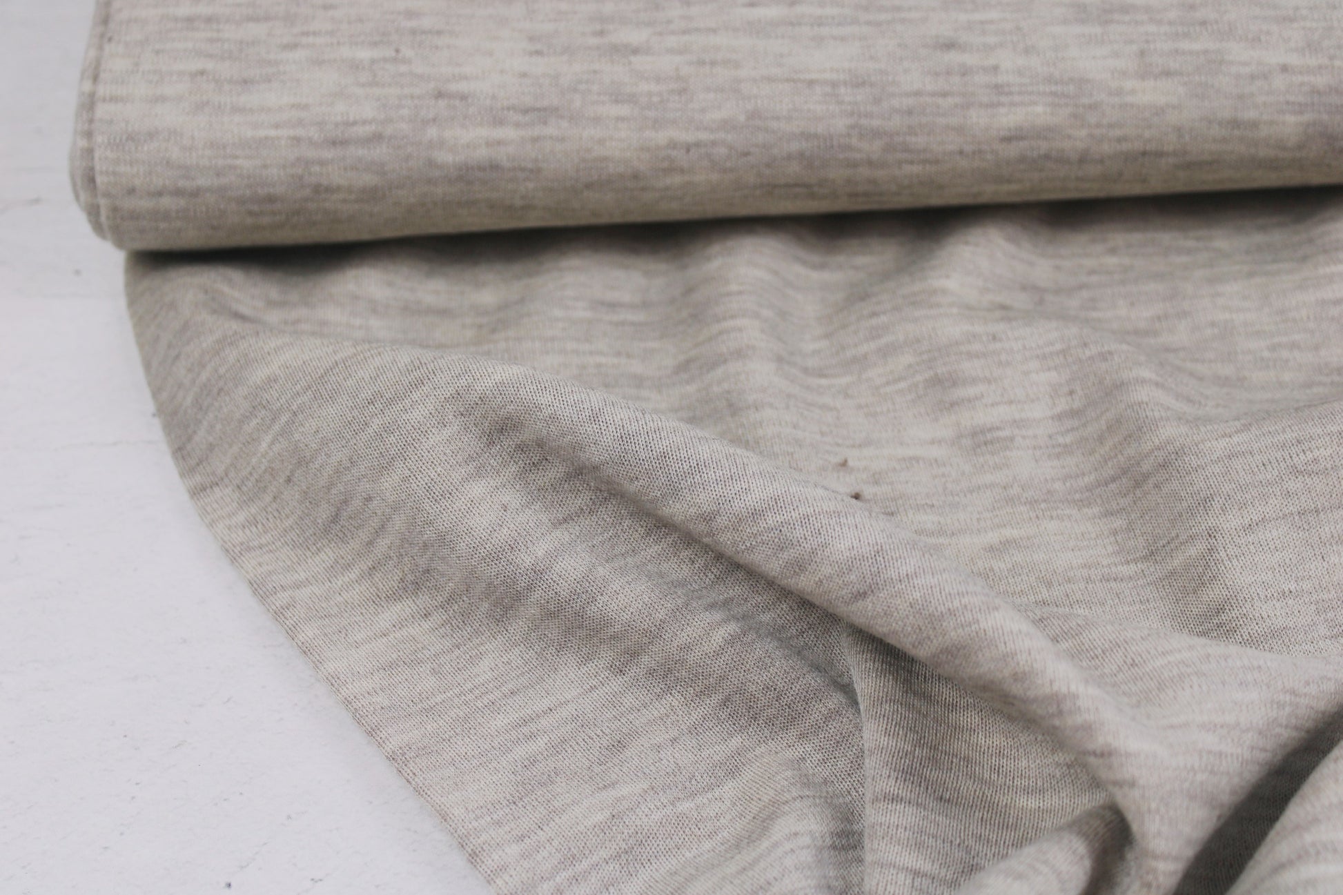 Wolljersey Merinostrickstoff Dunkelbeige meliert Ballenansicht